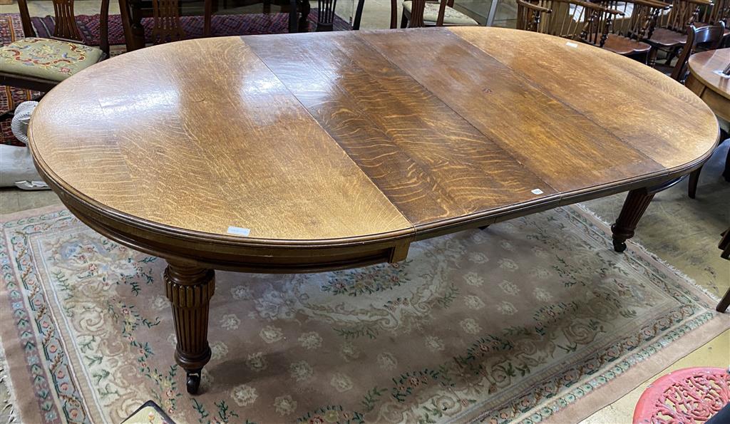 A late Victorian oak extending dining table with two leaves, 270cm extended, width 138cm, height 76cm